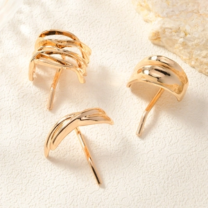 Macro detail of elegant golden wave texture hair clips and modern alloy hair pins