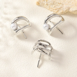 Detailed view of silver minimalist metal hair hook pins and pearl clip accessories