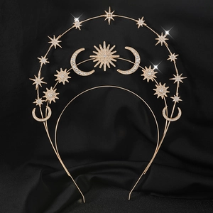 Golden sun star goddess crown with crystals on black velvet background for boho festivals