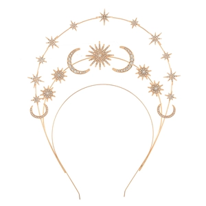 Detail of a gold sun goddess crown featuring triple-layered stars and moon embellishments