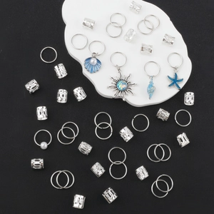Silver braided hair ring set featuring ocean-themed blue enamel charms and sun pendants