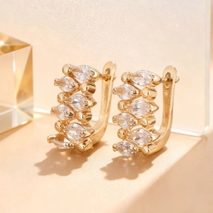 Rose gold huggie earrings with marquise-cut cubic zirconia in a minimalist U-shaped design