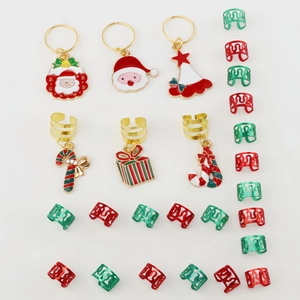 Detailed view of Christmas themed alloy braid charms and red green dreadlock jewelry set