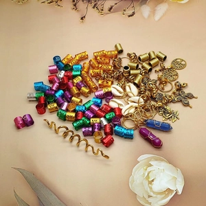 Detailed macro view of 125pcs colorful dreadlock beads with crystal and shell pendants