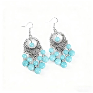 Boucles d'oreilles bohèmes avec perles turquoise et pompons mandala argentés