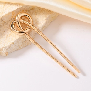 Elegant gold alloy U-shaped hair pin with stylish knot design on silk and stone background