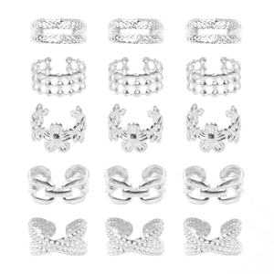 Detail view of 5 assorted silver ear cuff styles including floral and chain patterns