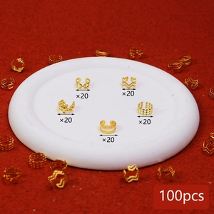 Macro detail of 100pcs gold plated hollow hair rings and DIY braid jewelry accessories