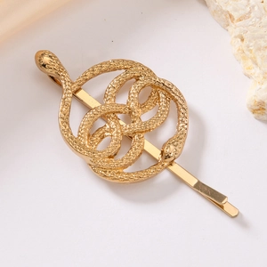 Golden double-headed snake hair clip with infinity symbol design and scale textures