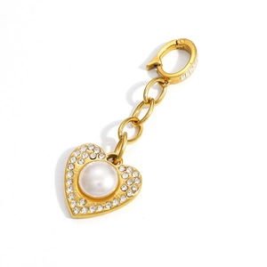 Golden heart pendant with pearl and rhinestones attached to a stylish chain and lobster clasp