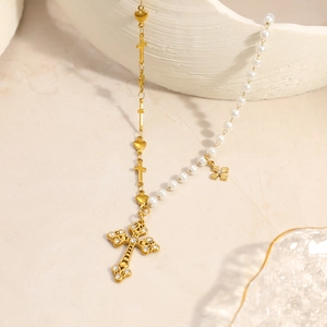 Gold-plated stainless steel necklace with heart, cross charms and pearl accents