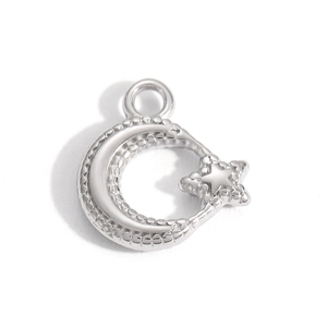 Detailed view of silver crescent moon and star pendant with polished bead texture