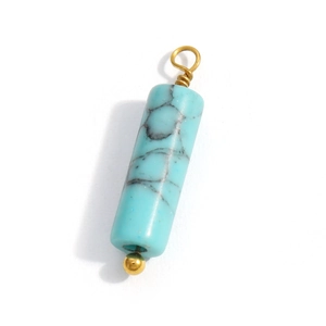 Cylindrical natural turquoise pendant with gold wire wrap on a white background