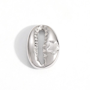 Detailed macro view of silver seashell pendant with starfish detail for DIY jewelry