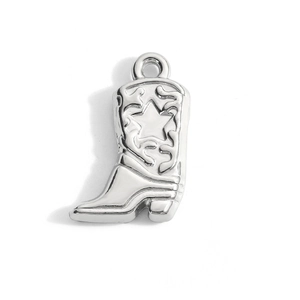 Detailed close-up of a silver stainless steel cowboy boot charm with a star design