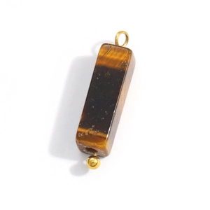 Macro detail of Tiger Eye stone pendant with polished finish and gold metal loop