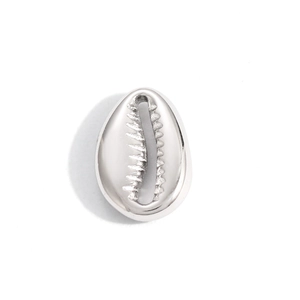 Close-up of a polished silver stainless steel cowrie shell pendant for DIY jewelry
