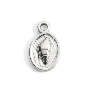 Macro detail of oval stainless steel pendant featuring a conch relief and high silver polish