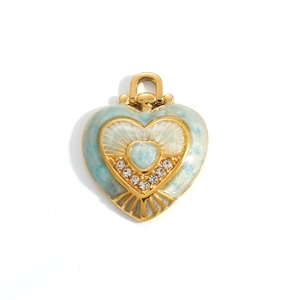 Detailed close-up of 18K gold plated heart pendant with light blue enamel and sparkling zircons