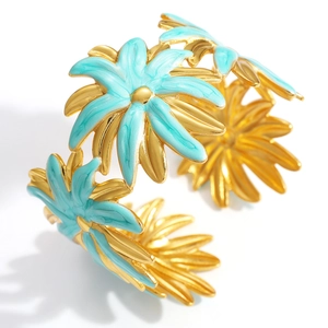 Macro detail of adjustable floral daisy bangle with light blue enamel and 18K gold plating