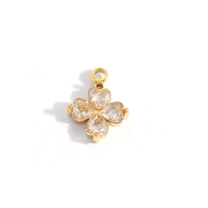 Detail showing gold clover pendant with four heart-shaped zircons and metal bail
