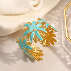 Adjustable 18K gold plated stainless steel floral bangle with light blue enamel petals
