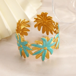 Double-layered 18k gold plated stainless steel open bangle with blue enamel flowers