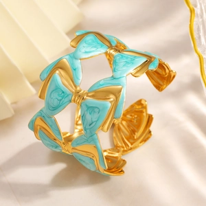 Bracelet jon jonc nœud en acier inoxydable doré 18K avec émail bleu clair texture marbre