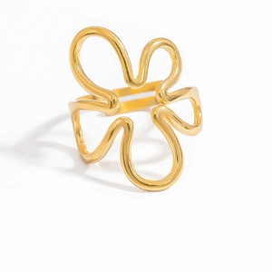 Close-up of golden wavy floral open ring featuring a minimalist five-petal outline design