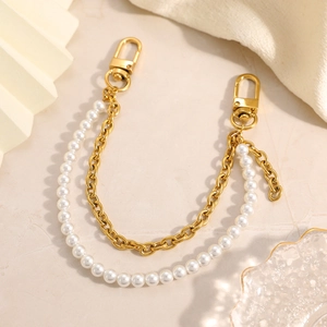 Elegant double-layered pearl and gold chain bag charm with durable metal lobster clasps