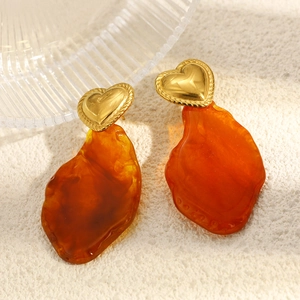 Bohemian gold heart earrings with irregular amber resin pendants in a vintage style