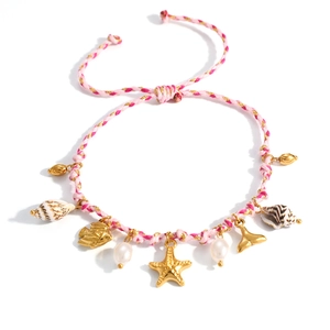 Pulsera océano bañada en oro 18K con estrella de mar, caracola y cordón trenzado rosa