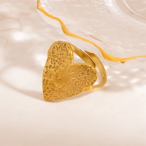 Minimalist 18K gold-plated stainless steel heart ring with hammered texture on white fabric