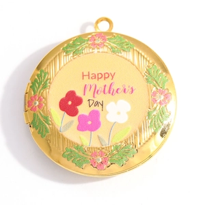 Macro shot of gold-plated Mother's Day locket with colorful flower patterns and engraving