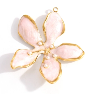Detail of pink enamel flower pendant with pearls on a gold stainless steel base