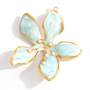 Detailed close-up of a blue enamel flower pendant with golden edges and pearls