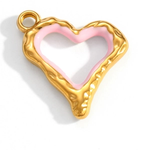 Macro detail of gold hammered heart pendant with pink enamel and 18K gold finish