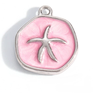 Macro view of 18K gold plated starfish pendant with pink glitter enamel inlay