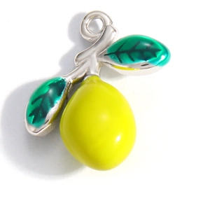 Detail of yellow enamel lemon pendant with green leaves and silver-tone loop charm