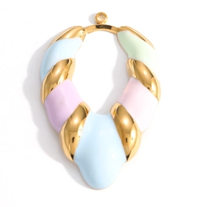 Macro shot of oval enamel flower pendant with pastel blue, pink, and mint green colors