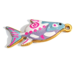 Macro detail of tropical fish charm with colorful enamel and 18K gold plated finish