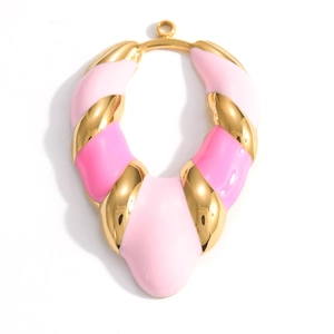 Detail of U-shape golden pendant with pink enamel finish for DIY jewelry making