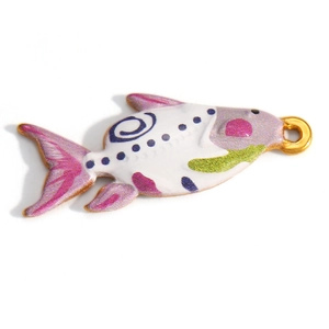 Macro shot of fish-shaped gold-plated enamel pendant with purple and blue detailing