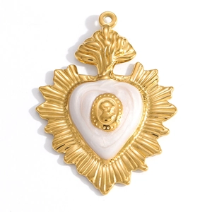 Detailed close-up of a vintage baroque gold-plated heart pendant with cameo relief