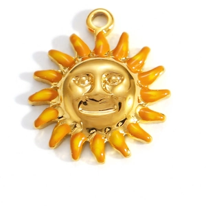 Detailed macro view of 18K gold plated smiling sun flower pendant with orange enamel