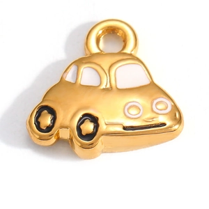 Macro detail of a 18K gold plated car pendant with white enamel finish and jump ring