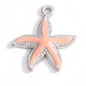 Macro detail of starfish pendant with coral pink enamel and 18K gold plated stainless steel