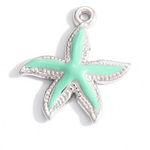 Detail of starfish pendant with mint green enamel inlay and polished silver base