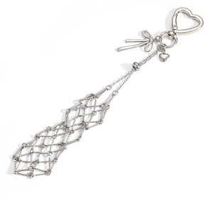 Detail of silver heart carabiner and bow pendant with expandable metal mesh tube structure