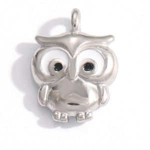 Close-up of owl charm pendant with white enamel belly and metal hanging loop for DIY jewelry